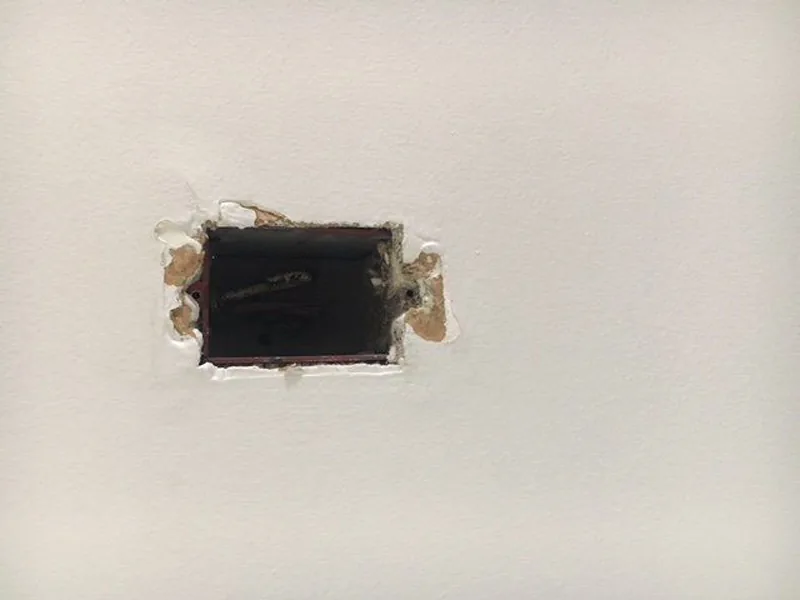 Drywall hole repair in progress
