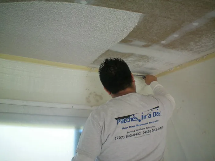 Skim coating and texturing drywall repair